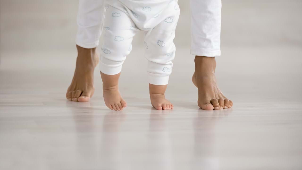 Children feet on a concrete floor